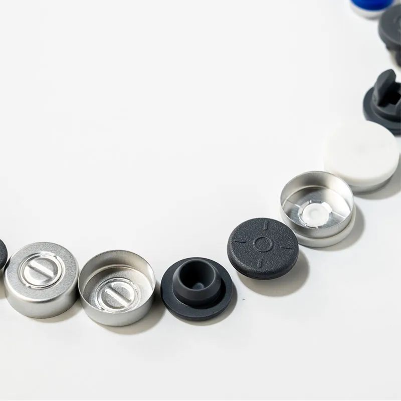 Bouchons en caoutchouc et capsules plastique-alu